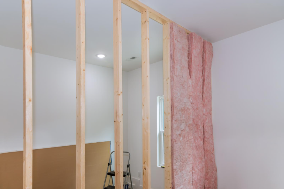 A wall frame with insulation inside a home